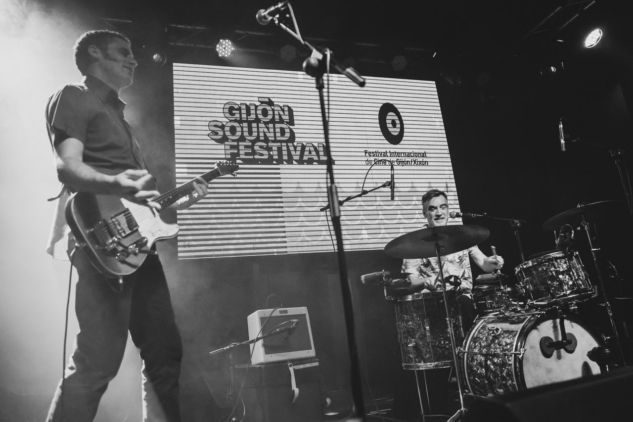 A guitarist plays beside a drum kit at Gijón Sound Festival